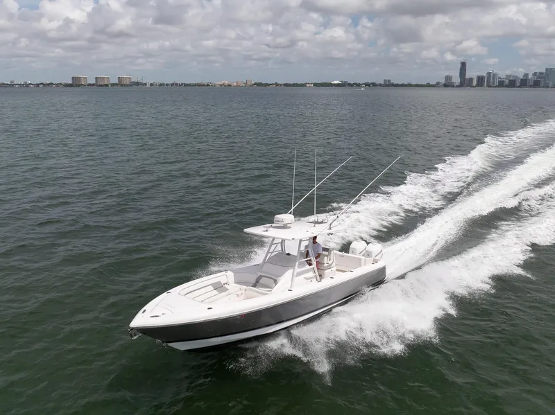 Slide: The Image of 2019 Intrepid 327 Center Console boat cruising on open water. - 11