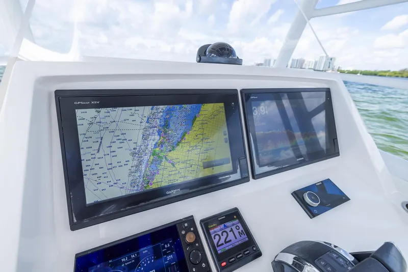 Slide: The Image of 2019 Intrepid 327 Center Console navigation system with dual display screens. - 20