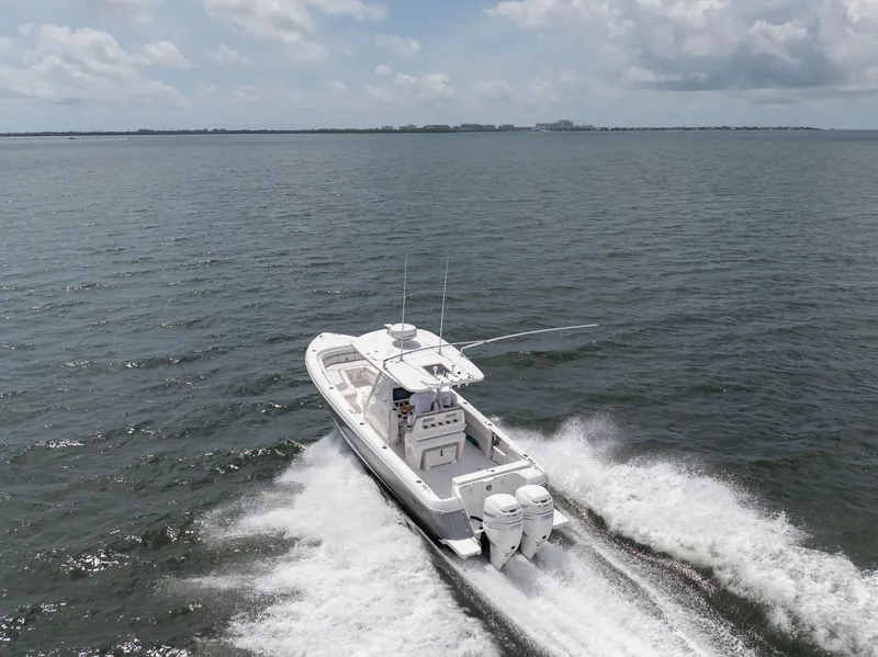 Slide: The Image of 2019 Intrepid 327 Center Console boat cruising on open water. - 28