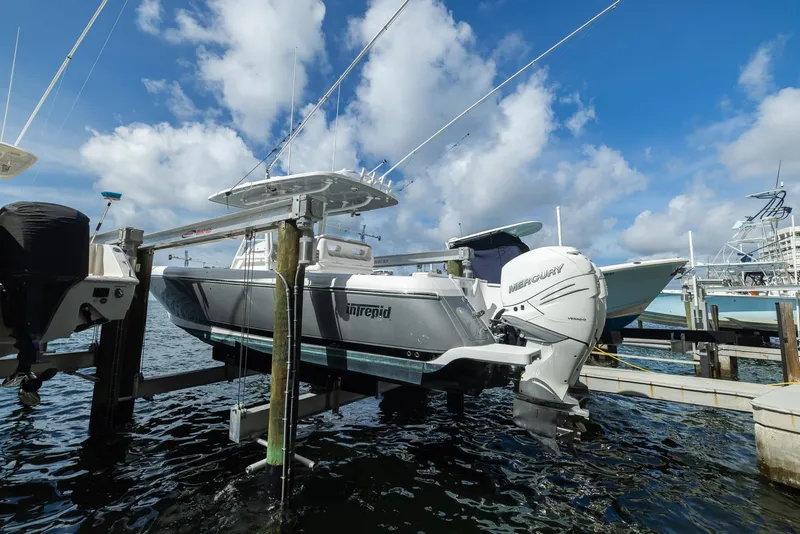 Slide: The Image of 2019 Intrepid 327 Center Console boat docked at marina. - 33