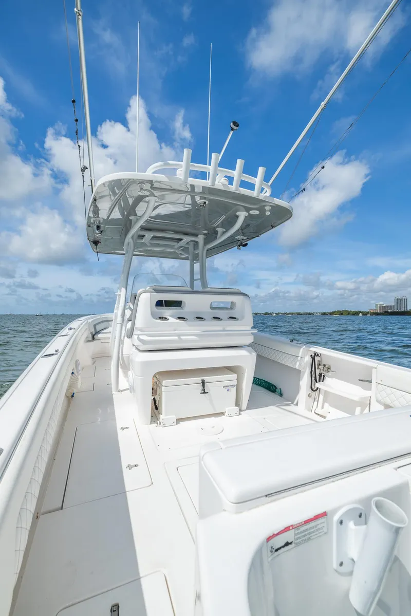 Slide: The Image of 2019 Intrepid 327 Center Console boat on open water. - 43