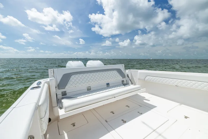 Slide: The Image of 2019 Intrepid 327 Center Console boat with open deck and ocean view. - 49