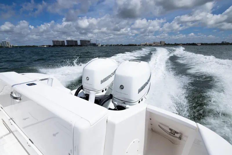 Slide: The Image of 2019 Intrepid 327 Center Console boat with twin Mercury outboard engines on the water. - 6