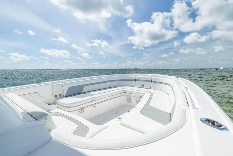 Slide: The Image of 2019 Intrepid 327 Center Console boat with spacious seating on open water. - 8