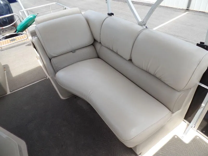 Slide: The Image of 2013 SunCatcher Elite 326 SS boat with comfortable beige seating. - 10