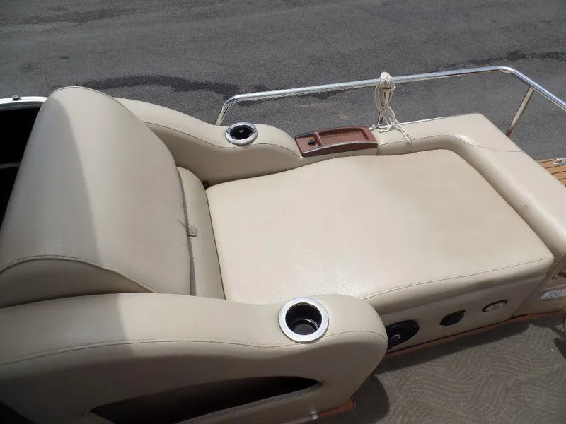 Slide: The Image of 2013 SunCatcher Elite 326 SS boat with beige leather seating and cup holders. - 15