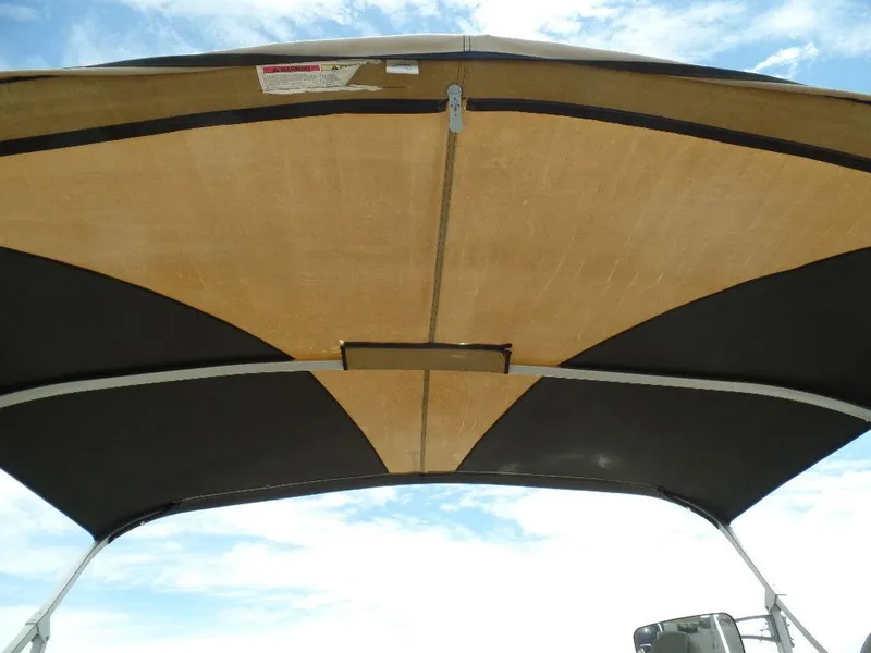 Slide: The Image of 2013 SunCatcher Elite 326 SS boat canopy against blue sky. - 20