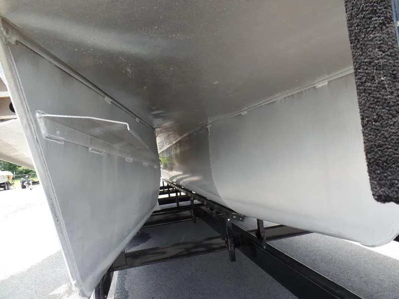 Slide: The Image of Underneath view of 2013 SunCatcher Elite 326 SS pontoon boat on trailer. - 21
