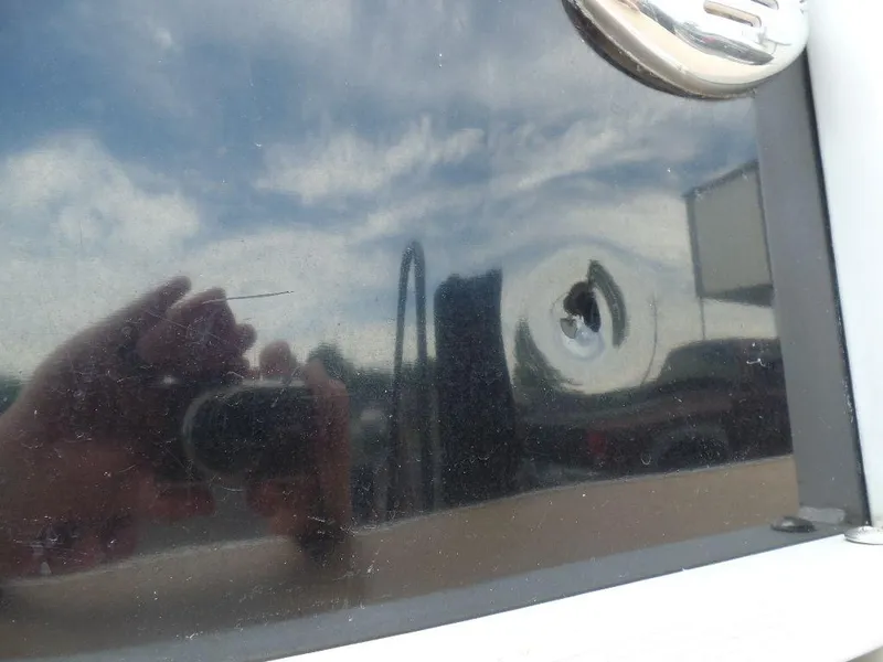 Slide: The Image of Reflection on 2013 SunCatcher Elite 326 SS boat's glossy surface. - 26