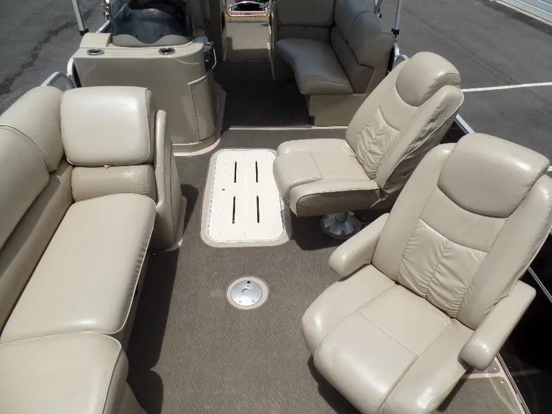 Slide: The Image of 2013 SunCatcher Elite 326 SS boat interior with beige leather seating. - 4