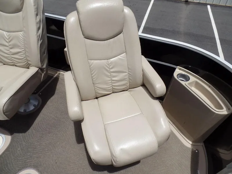 Slide: The Image of 2013 SunCatcher Elite 326 SS beige captain's chair with armrests. - 6