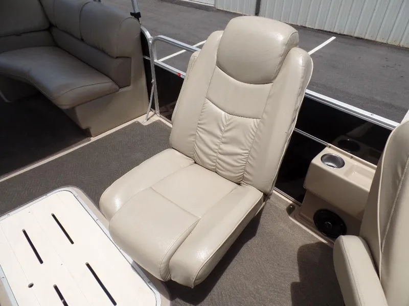 Slide: The Image of 2013 SunCatcher Elite 326 SS boat interior with beige leather seating. - 7