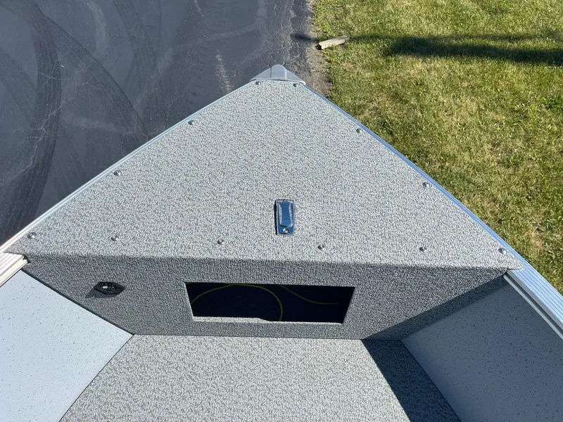 Slide: The Image of 2025 Lund 1600 Fury Tiller boat bow with storage compartment. - 12