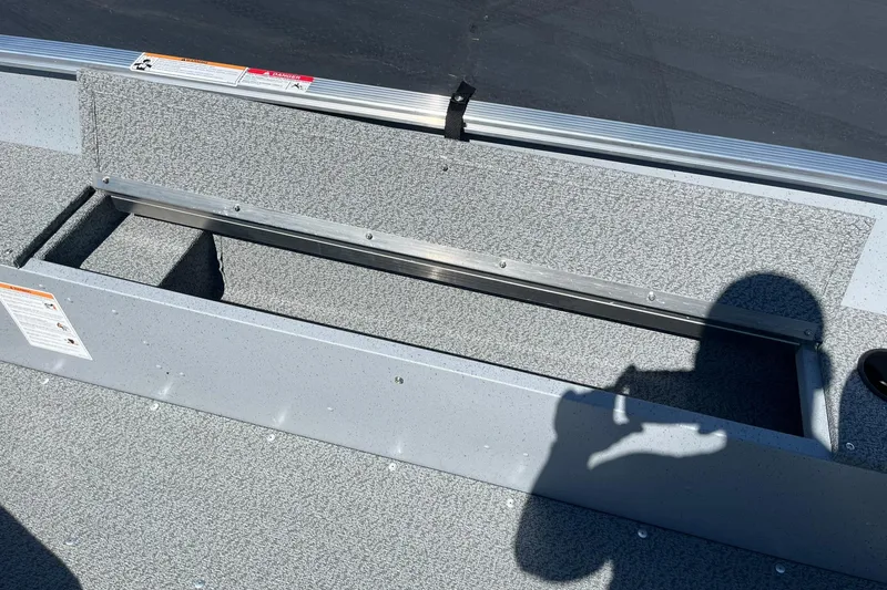 Slide: The Image of 2025 Lund 1600 Fury Tiller boat interior with storage compartment. - 18