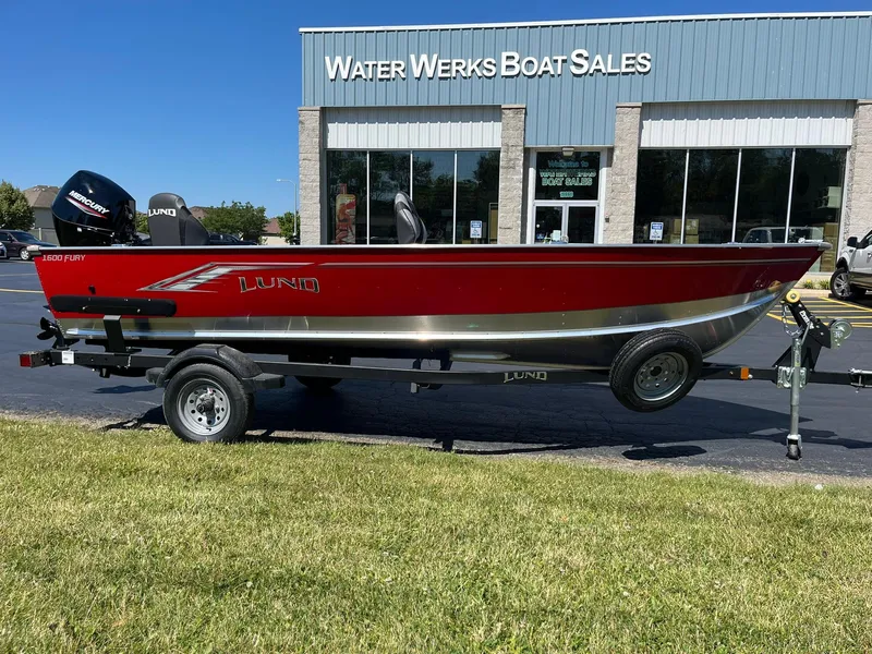 Slide: The Image of 2025 Lund 1600 Fury Tiller boat on trailer outside Water Werks Boat Sales. - 2