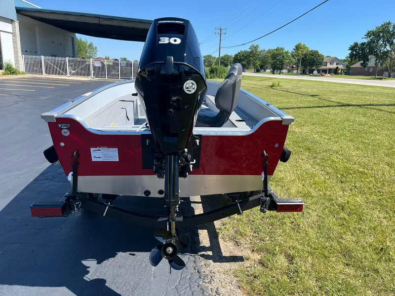 Slide: The Image of 2025 Lund 1600 Fury Tiller boat with 30 HP motor, rear view. - 4