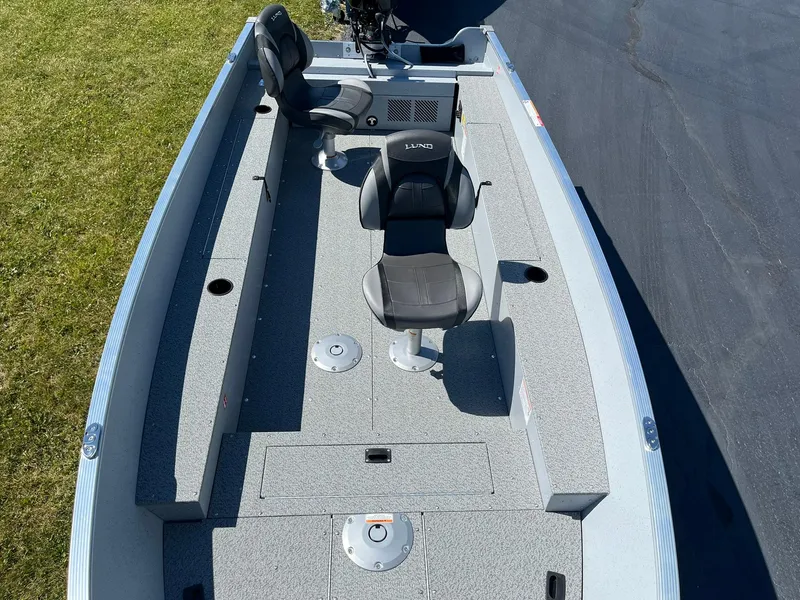 Slide: The Image of 2025 Lund 1600 Fury Tiller fishing boat with seating and storage compartments. - 8