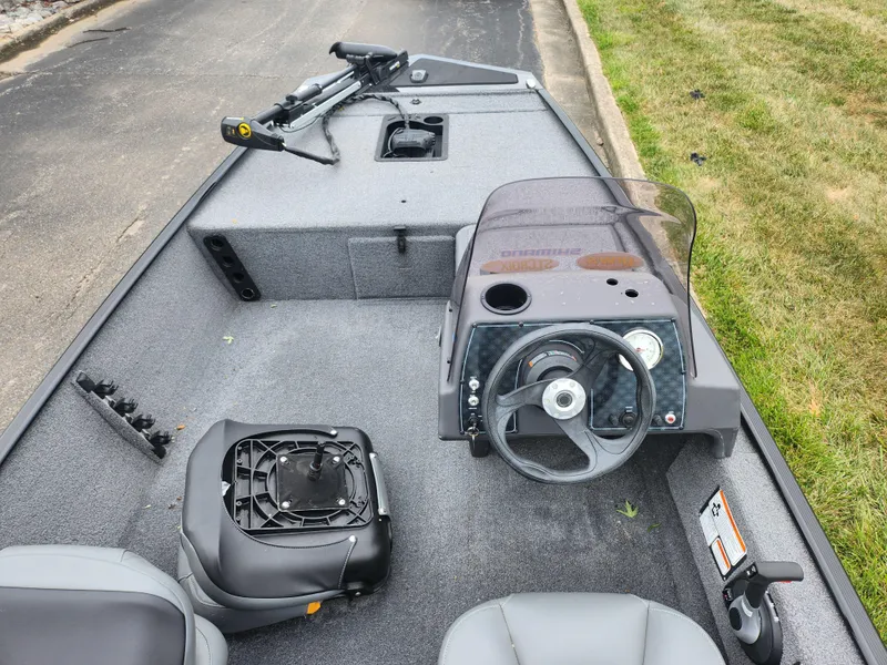 Slide: The Image of 2021 Tracker Bass Tracker Classic XL boat interior with steering console and seating. - 11