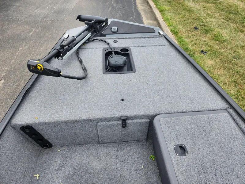 Slide: The Image of 2021 Tracker Bass Tracker Classic XL boat deck with trolling motor and storage compartments. - 14