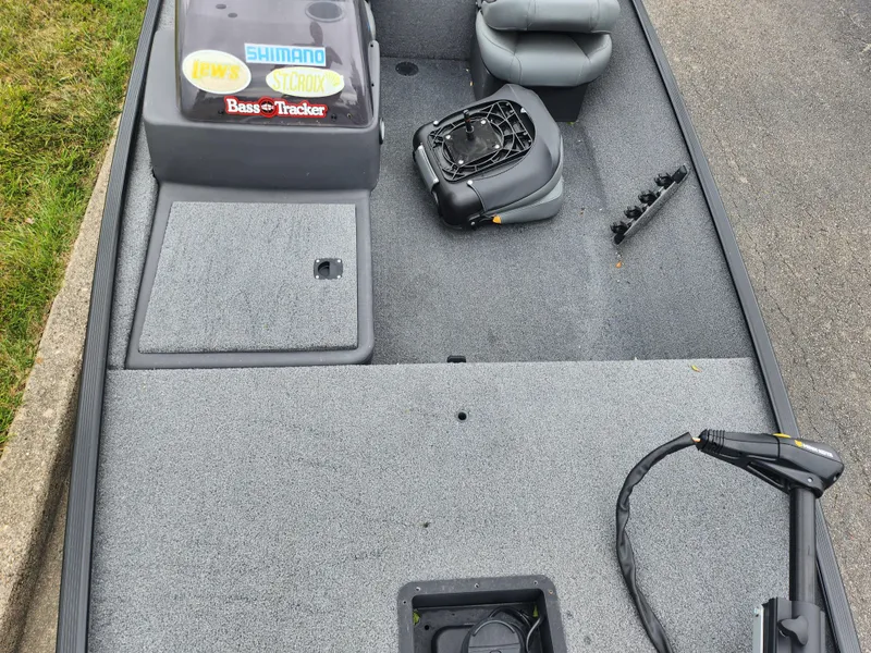 Slide: The Image of 2021 Tracker Bass Tracker Classic XL fishing boat interior with seats and equipment. - 17