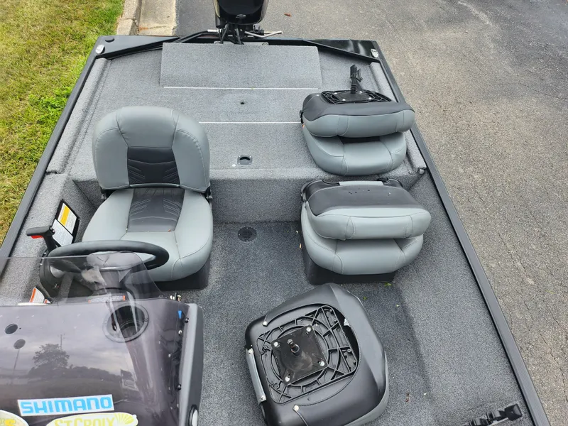 Slide: The Image of 2021 Tracker Bass Tracker Classic XL boat interior with gray seats and steering console. - 19