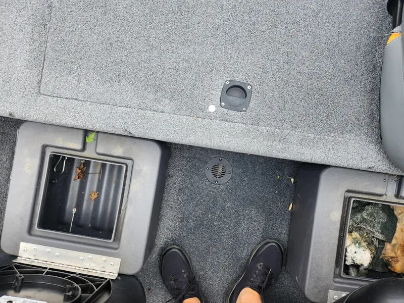 Slide: The Image of 2021 Tracker Bass Tracker Classic XL boat interior with storage compartments. - 20