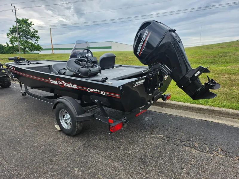 Slide: The Image of 2021 Tracker Bass Tracker Classic XL boat with Mercury outboard motor on trailer. - 3