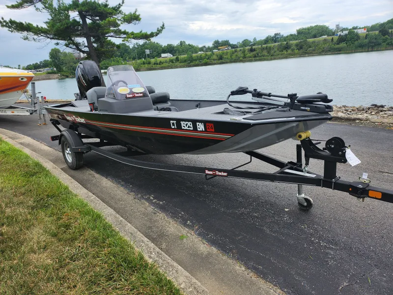 Slide: The Image of 2021 Tracker Bass Tracker Classic XL fishing boat on trailer by a lake. - 9