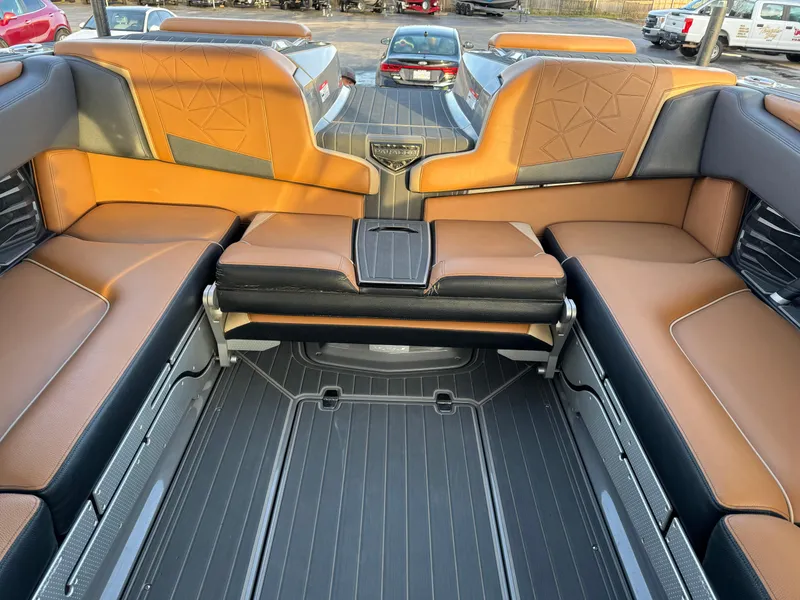 Slide: The Image of 2020 Nautique P23 boat interior with brown leather seating and modern design. - 3