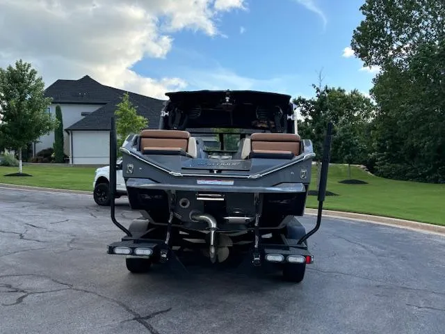 Slide: The Image of 2020 Nautique P23 boat on trailer, parked in residential area. - 8