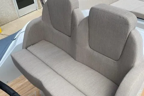 Slide: The Image of 2024 SACS Strider 900 boat seating with beige upholstery. - 5