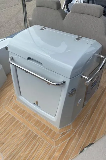 Slide: The Image of 2024 SACS Strider 900 boat interior with modern seating and storage unit. - 6