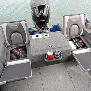 Slide: The Image of 2025 Lund Adventure 1775 Sport boat interior with storage compartments and motor. - 10