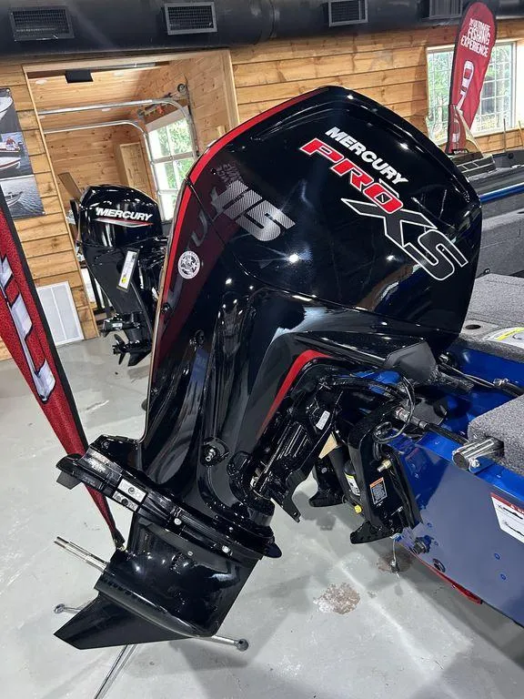 Slide: The Image of 2025 Lund Adventure 1775 Sport with Mercury Pro XS outboard motor in showroom. - 4