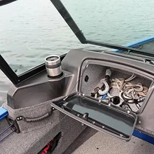 Slide: The Image of 2025 Lund Adventure 1775 Sport boat storage compartment with ropes and cup holder. - 12