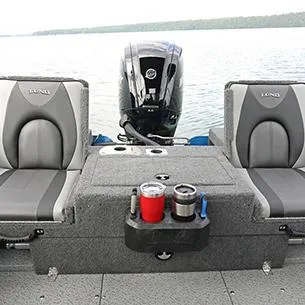 Slide: The Image of 2025 Lund Adventure 1775 Sport boat interior with seating and motor on a lake. - 9