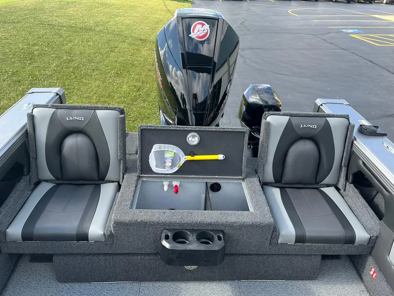 Slide: The Image of 2025 Lund 1975 Tyee boat interior with seating and storage compartments. - 10