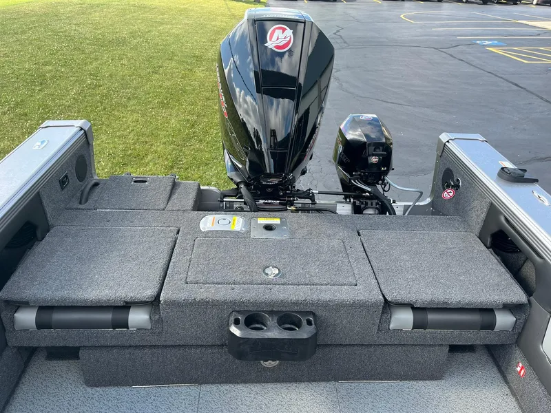 Slide: The Image of 2025 Lund 1975 Tyee boat with Mercury outboard motor, rear view. - 11