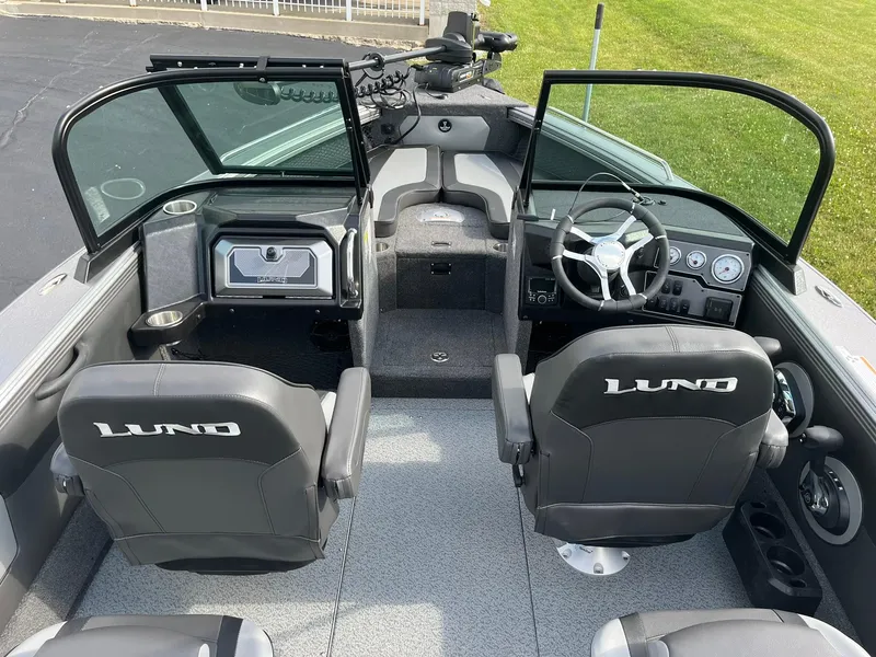 Slide: The Image of Interior of 2025 Lund 1975 Tyee boat with dual seats and steering console. - 6