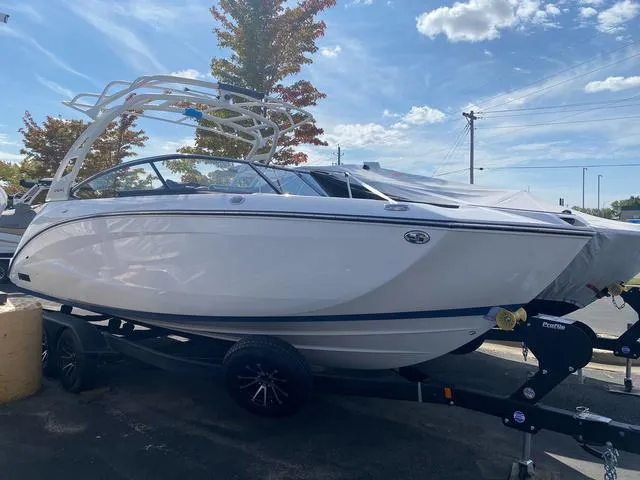 Slide: The Image of 2024 Yamaha Boats 252SD, sleek white design with black canopy. - 1