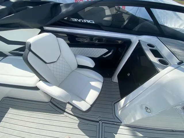 Slide: The Image of 2024 Yamaha Boats 252SD interior with white seating and sleek design. - 17