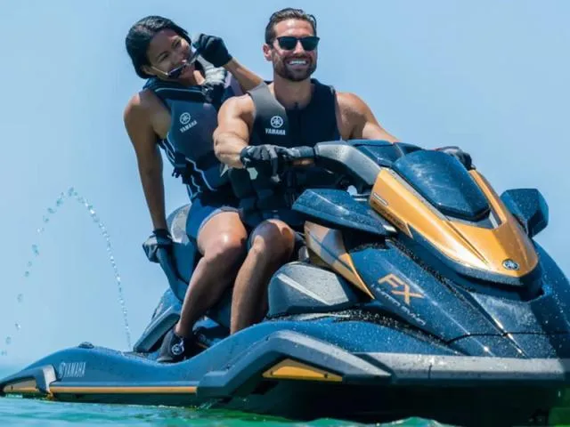 Slide: The Image of 2024 Yamaha Waverunner FX Limited SVHO with Audio System on water, two riders enjoying. - 4