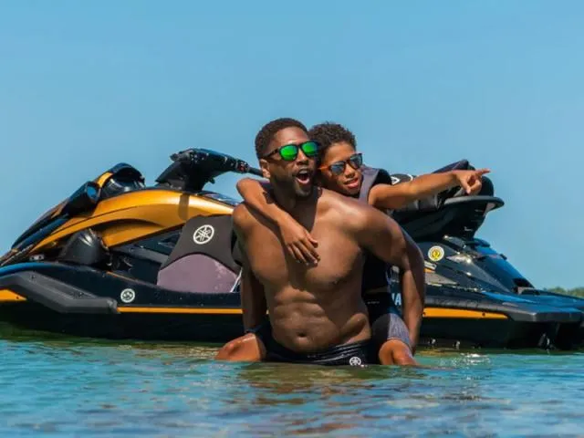 Slide: The Image of Two people enjoying water near a 2024 Yamaha Waverunner FX Limited SVHO. - 6