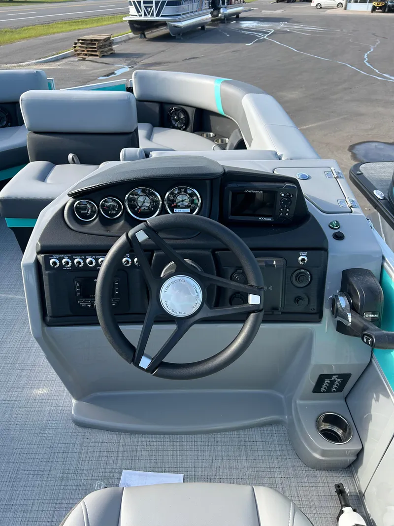 Slide: The Image of Steering console of 2025 Trifecta 20CCS boat with gauges and controls. - 4