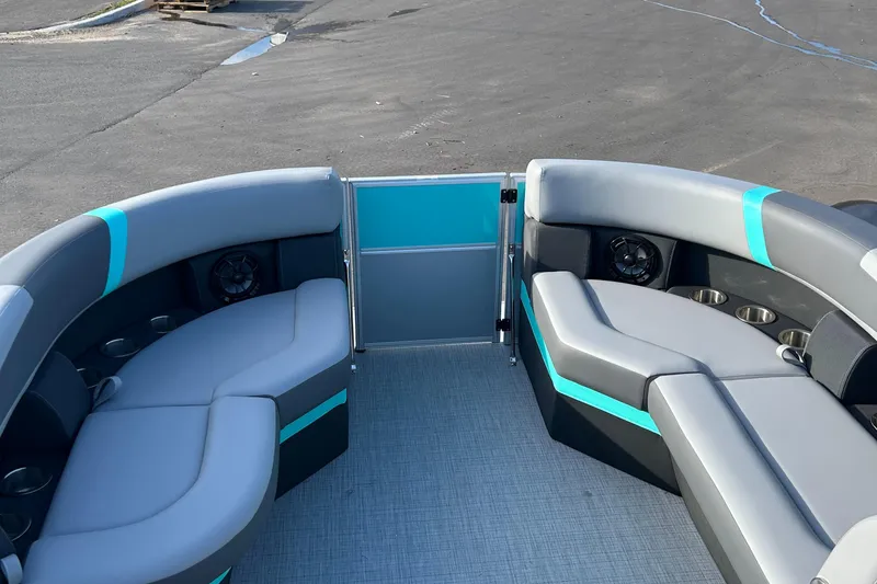 Slide: The Image of 2025 Trifecta 20CCS pontoon boat interior with gray and teal seating. - 6