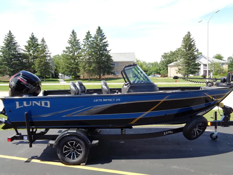 The Image of 2024 Lund 1875 Impact XS fishing boat on trailer. - 1