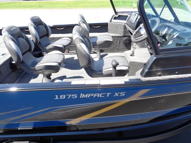 Slide: The Image of 2024 Lund 1875 Impact XS boat interior with seating and console. - 4