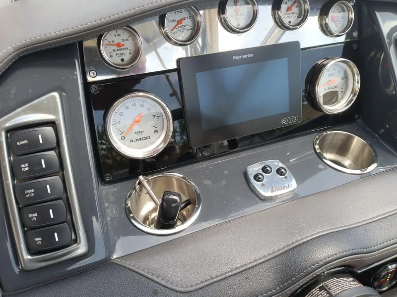 Slide: The Image of Dashboard of a 2019 Formula 270 Bowrider boat with gauges and Raymarine display. - 19