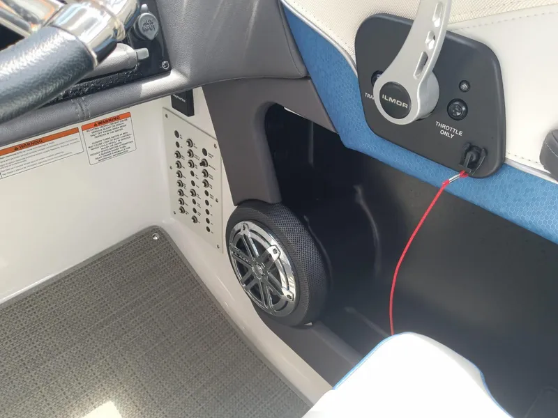 Slide: The Image of 2019 Formula 270 Bowrider cockpit with steering wheel, throttle, and speaker. - 20
