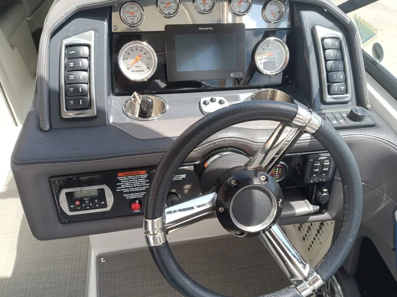 Slide: The Image of 2019 Formula 270 Bowrider dashboard with steering wheel, gauges, and control panel. - 21